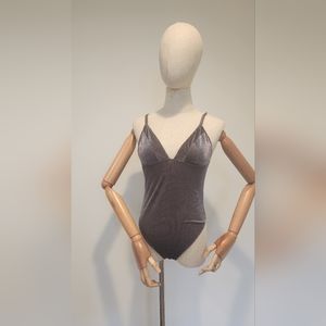 Bodysuit. Metalic shiny finish. NWOT.
